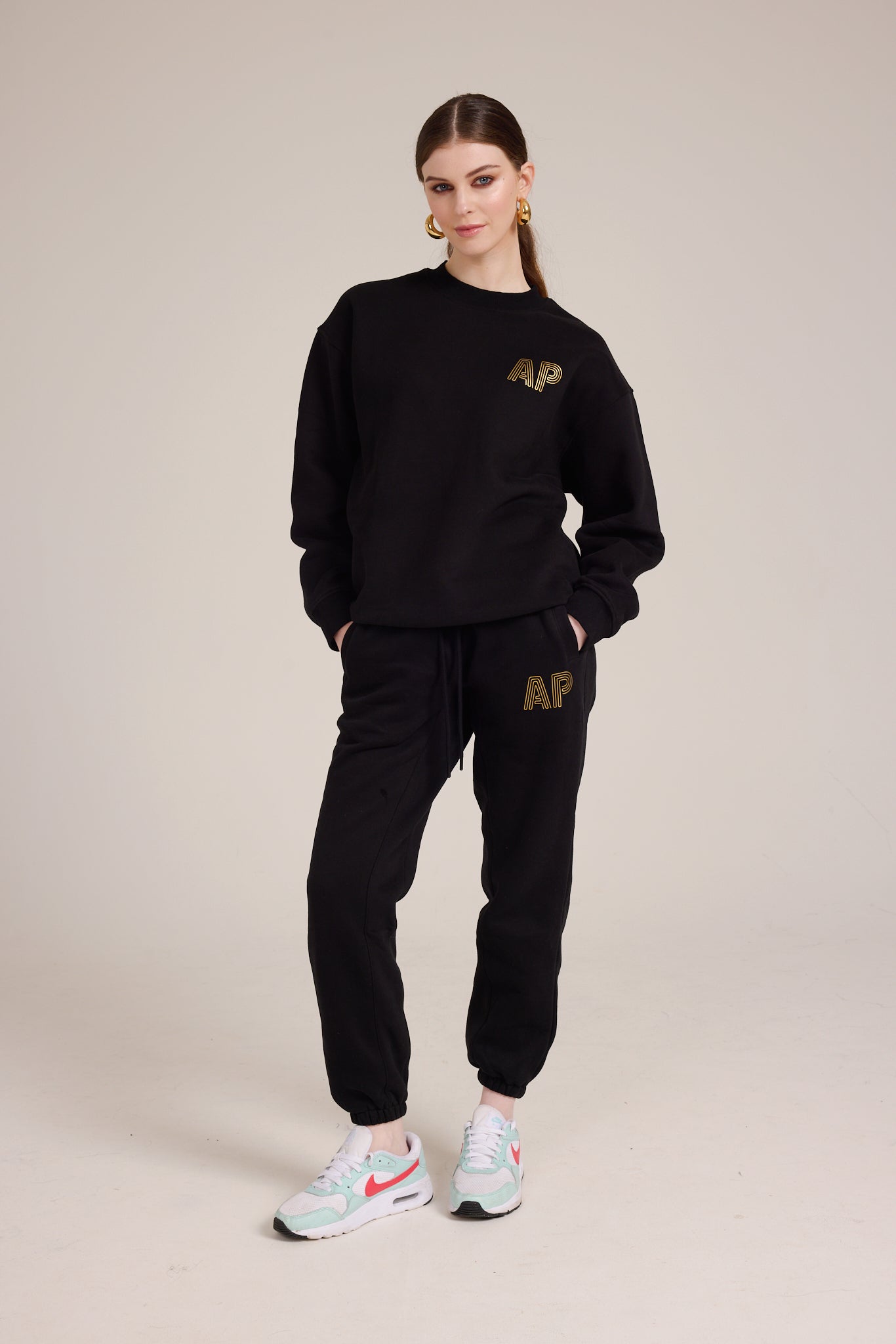 Cozy black tracksuit bottoms with AP logo on front right pocket in gold