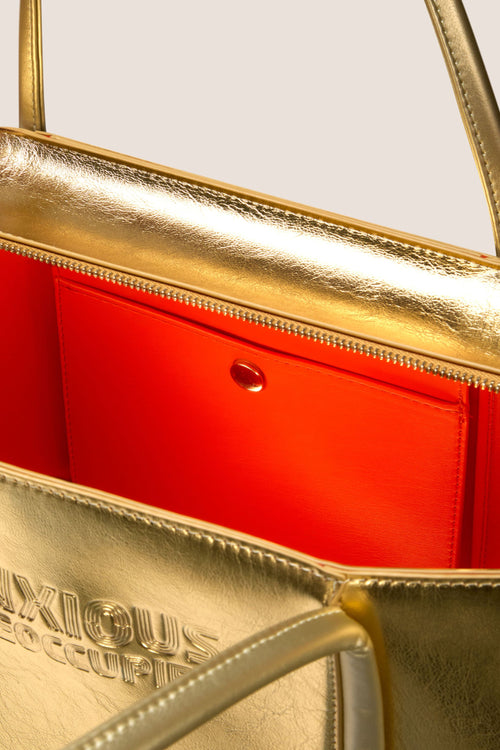Load image 1 in gallery view. The Zipped Mid Tote Bag: Gold Metallic